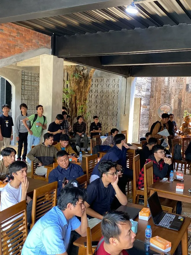 Participants watching a session at Hackathon Jogja